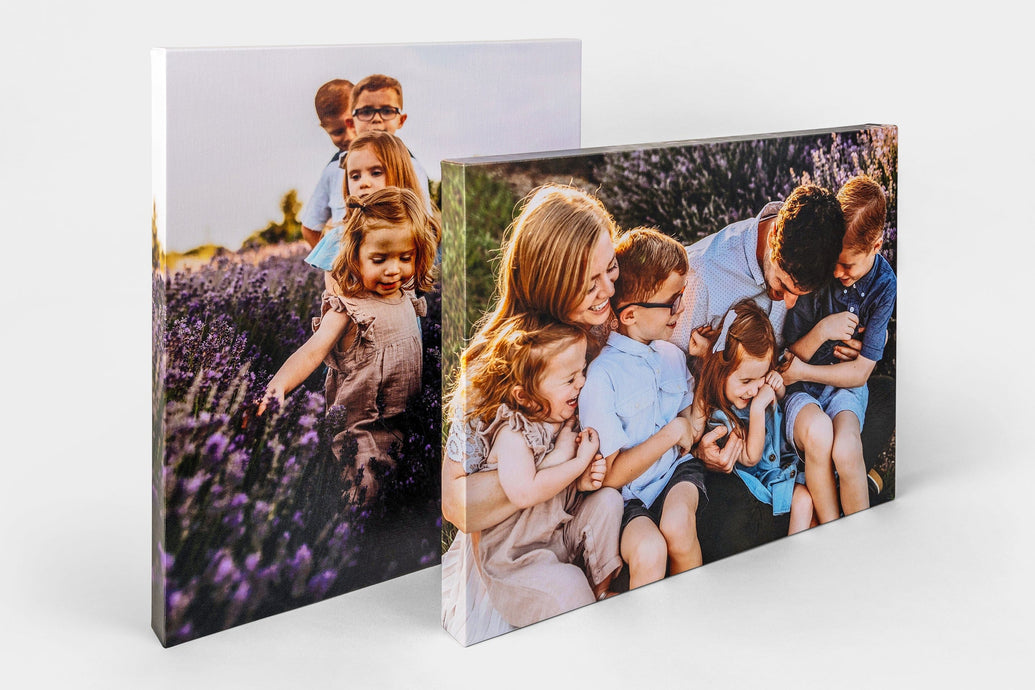 Two Premium Canvas Prints on a white background featuring a family having fun outdoors. The Canvases are shot from the side.