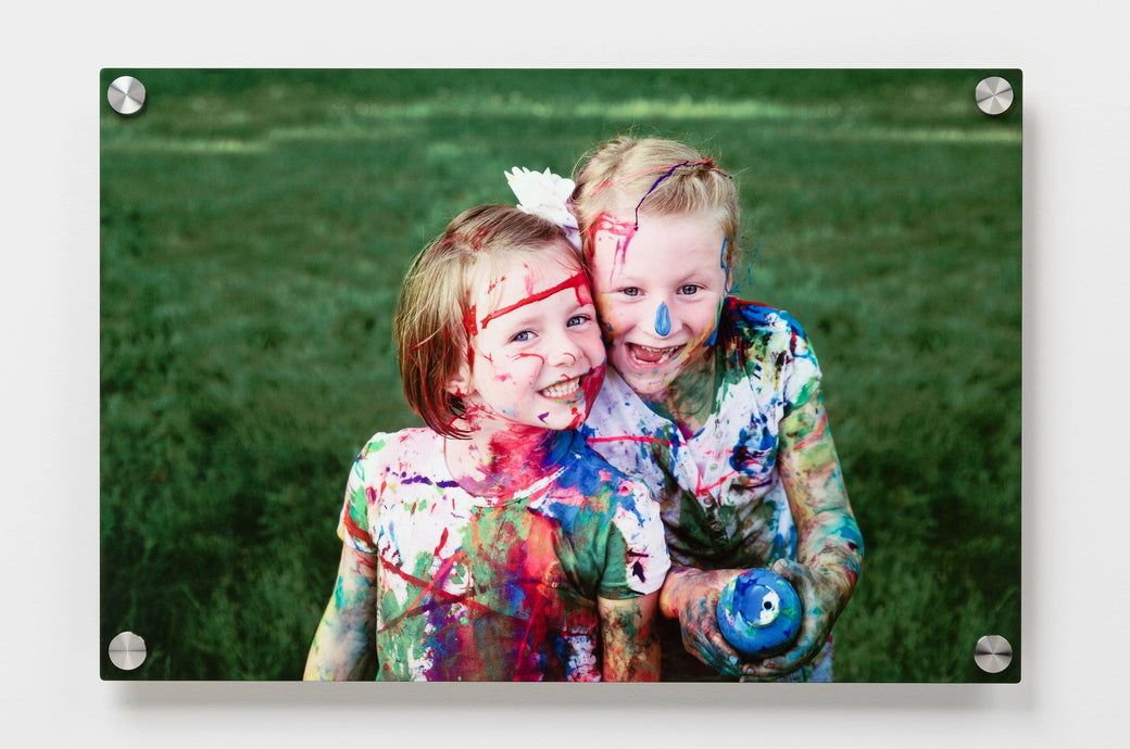 20x30 Metal Print Standoff with a photo of two little girls covered in paint. 