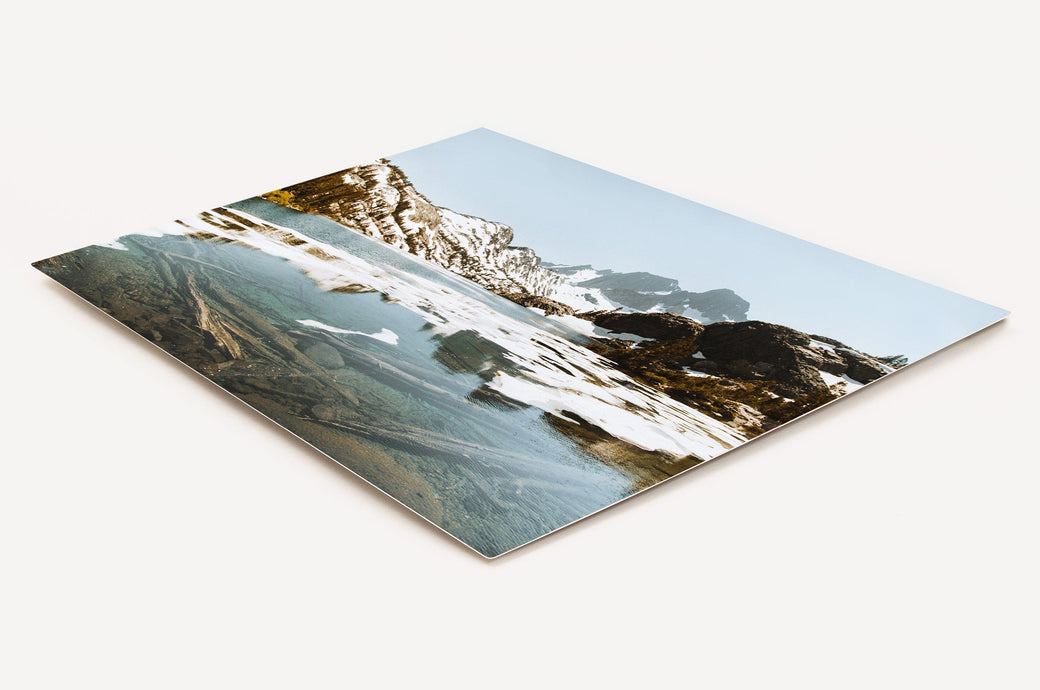 Angled shot of a 16x20" Metal Print with a photo of a wintery landscape on it. 