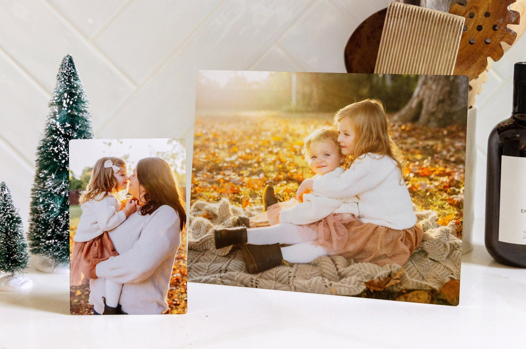 One 4x6" Metal print and one 8x10" Metal print, both featuring autumnal imagery of two girls and their mother. 