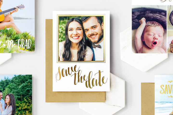 Flay lay of five Save the Date, Baby, and Grad Personalized Foil Cards