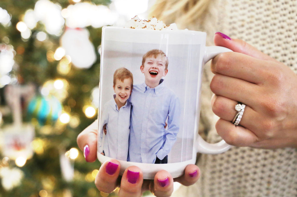 Woman holding a 15 oz. Photo Mug with a photo of two children. 