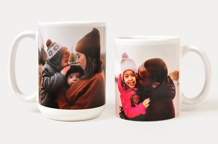 A 15oz Photo Mug and an 11oz Photo mug featuring wintery images of parents with their children. 